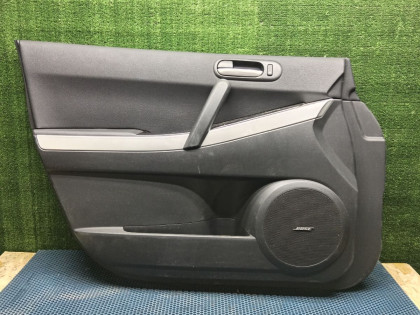 Обшивка двери передняя левая ER3P